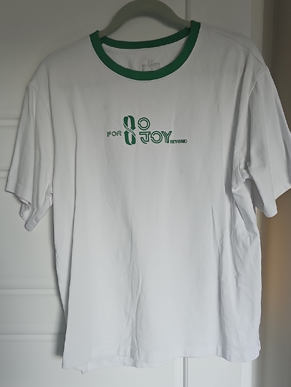 White T-Shirt with Green Trim and Graphic
